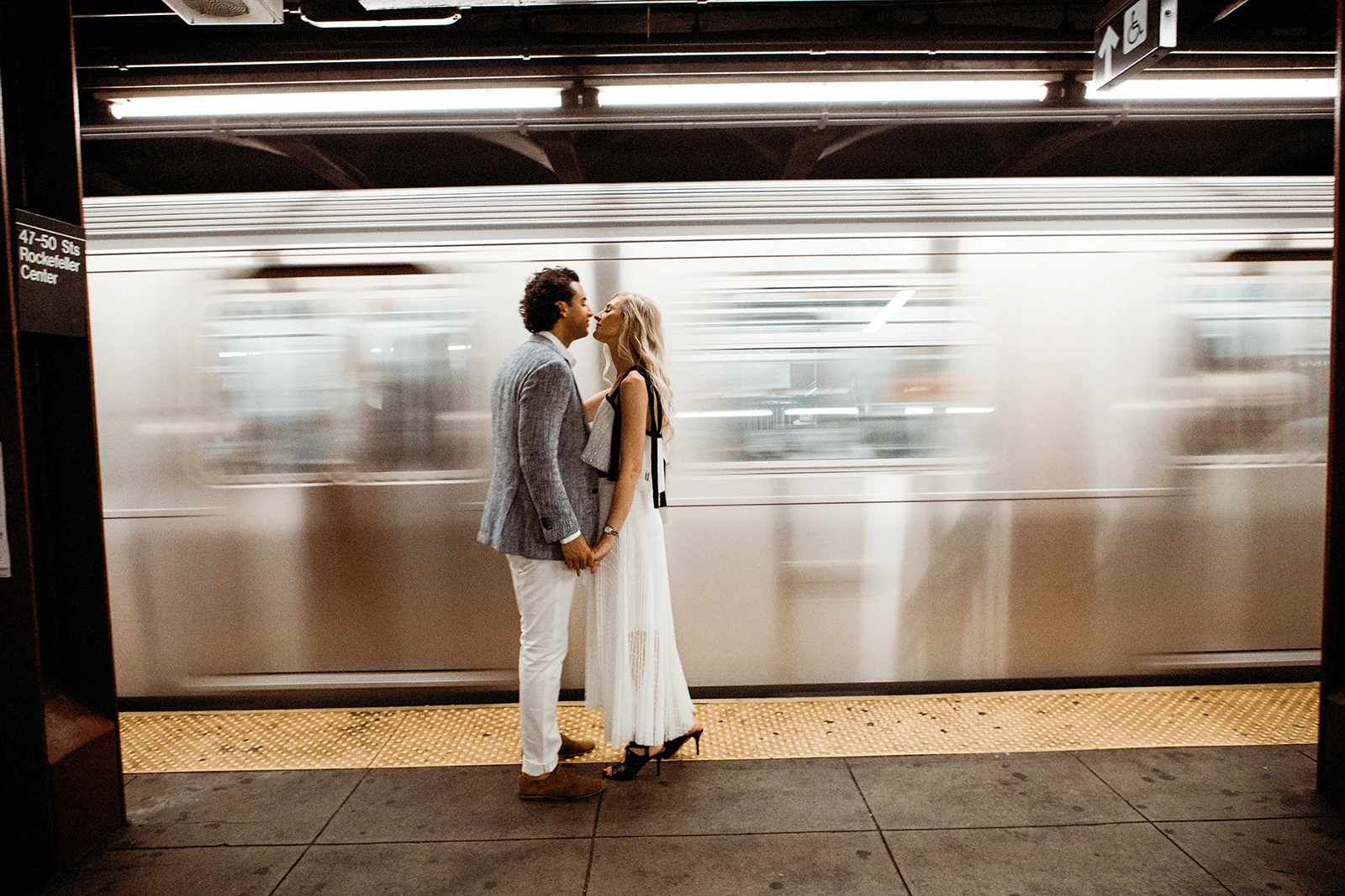 Couple kissing on the New York subway